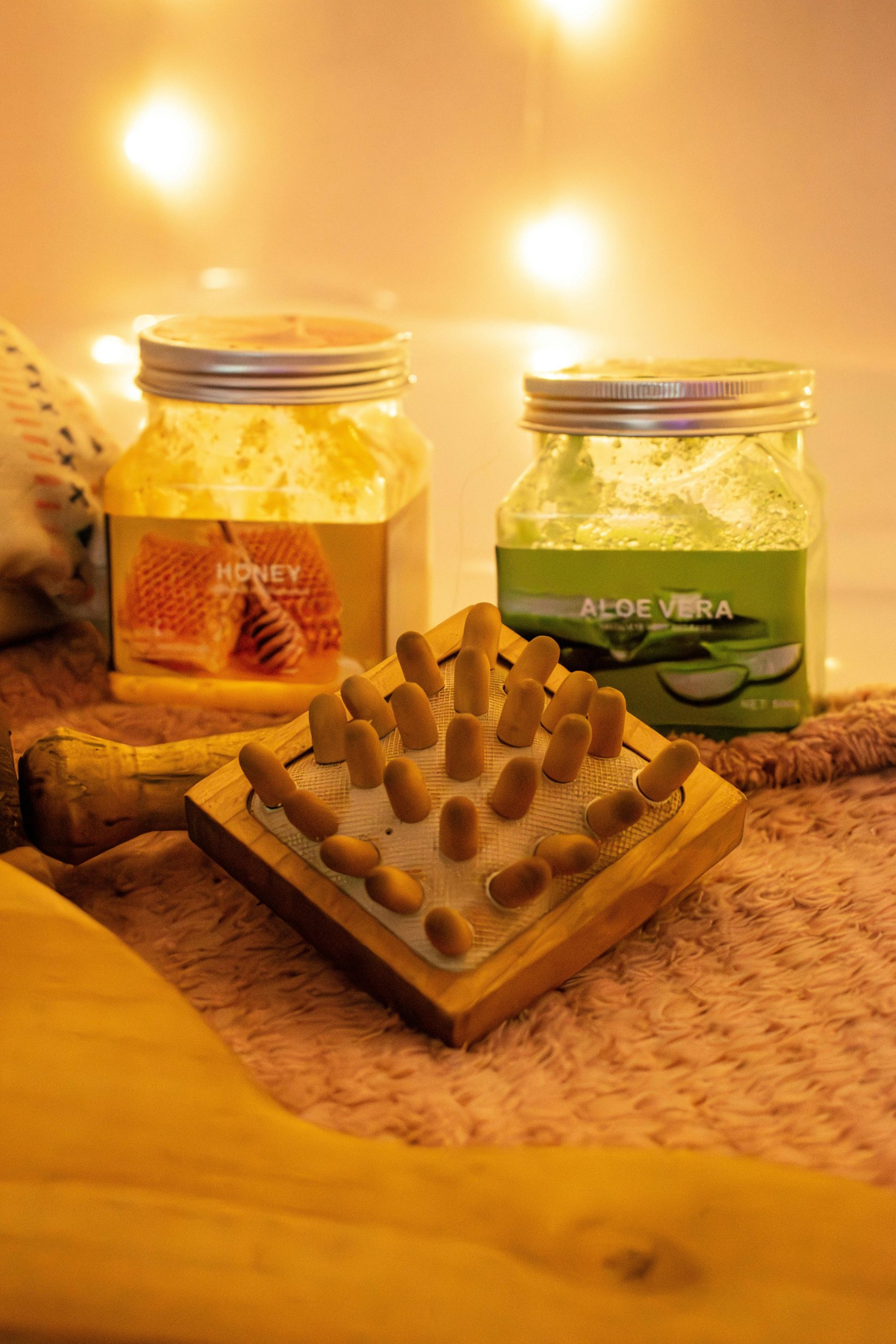 Tranquil spa setting with aloe vera and honey body scrubs, perfect for skincare routines.